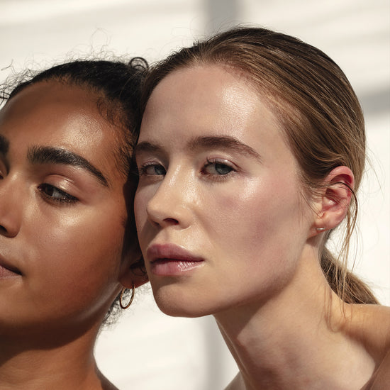 Two girls looking in to the camera