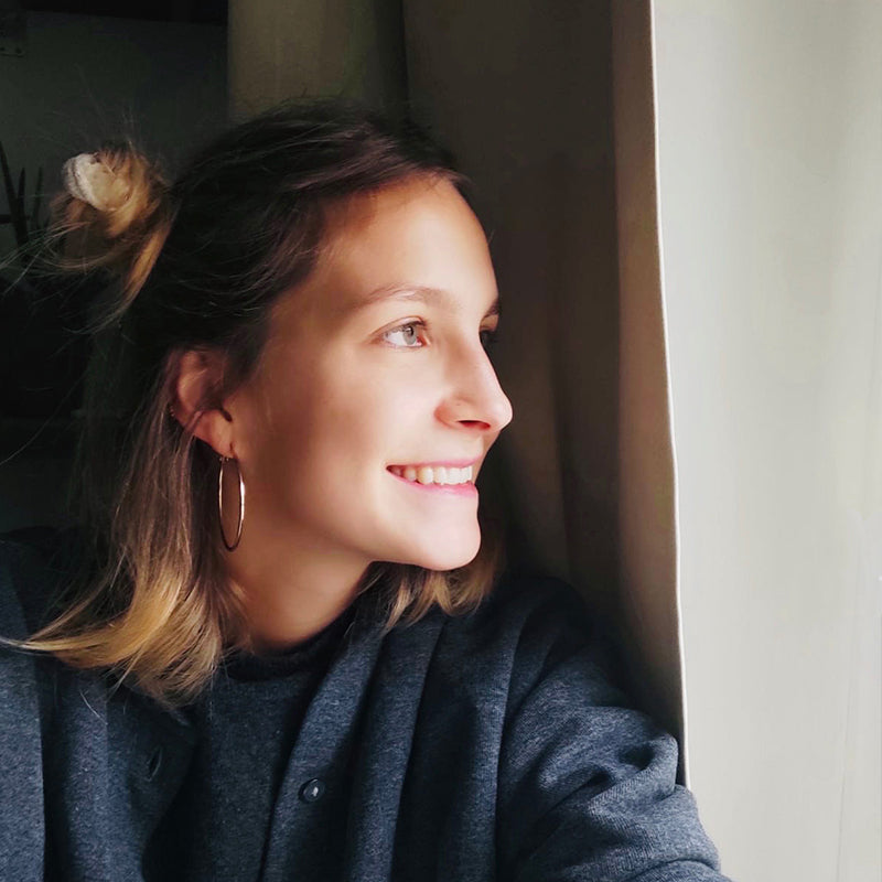 Natascha Baumgärtner - A picture of Klint Artist Natascha Baümgartner looking out of a window